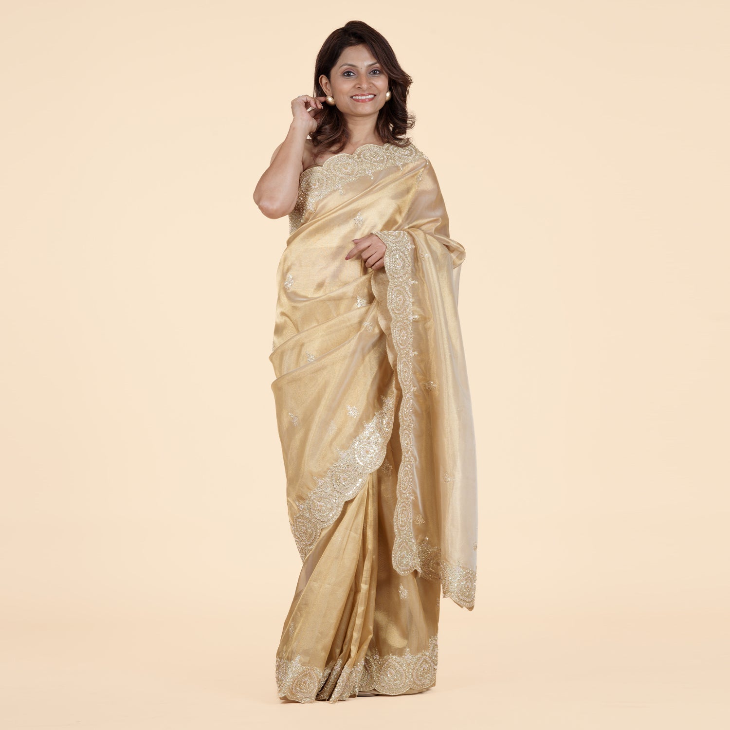 Luxurious Gold Tissue Saree with Cutdana Work