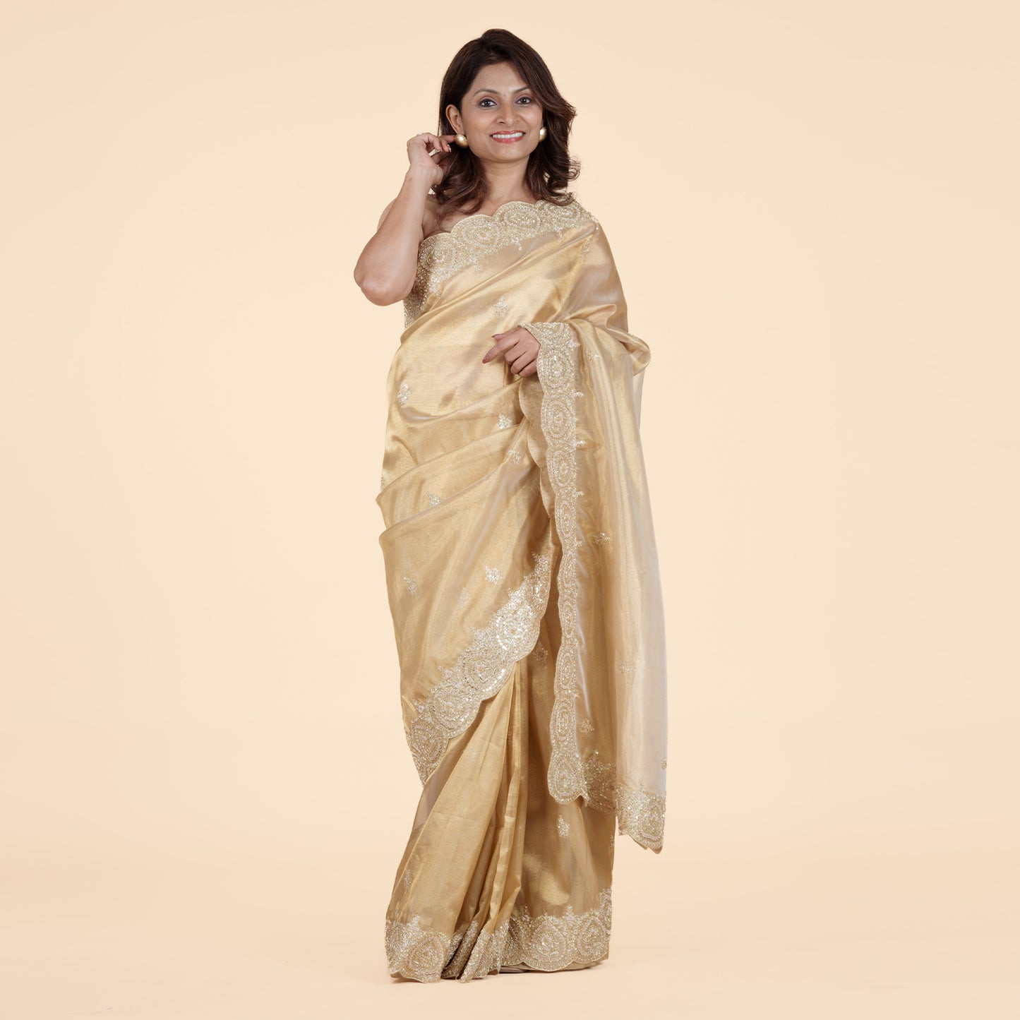 Luxurious Gold Tissue Saree with Cutdana Work