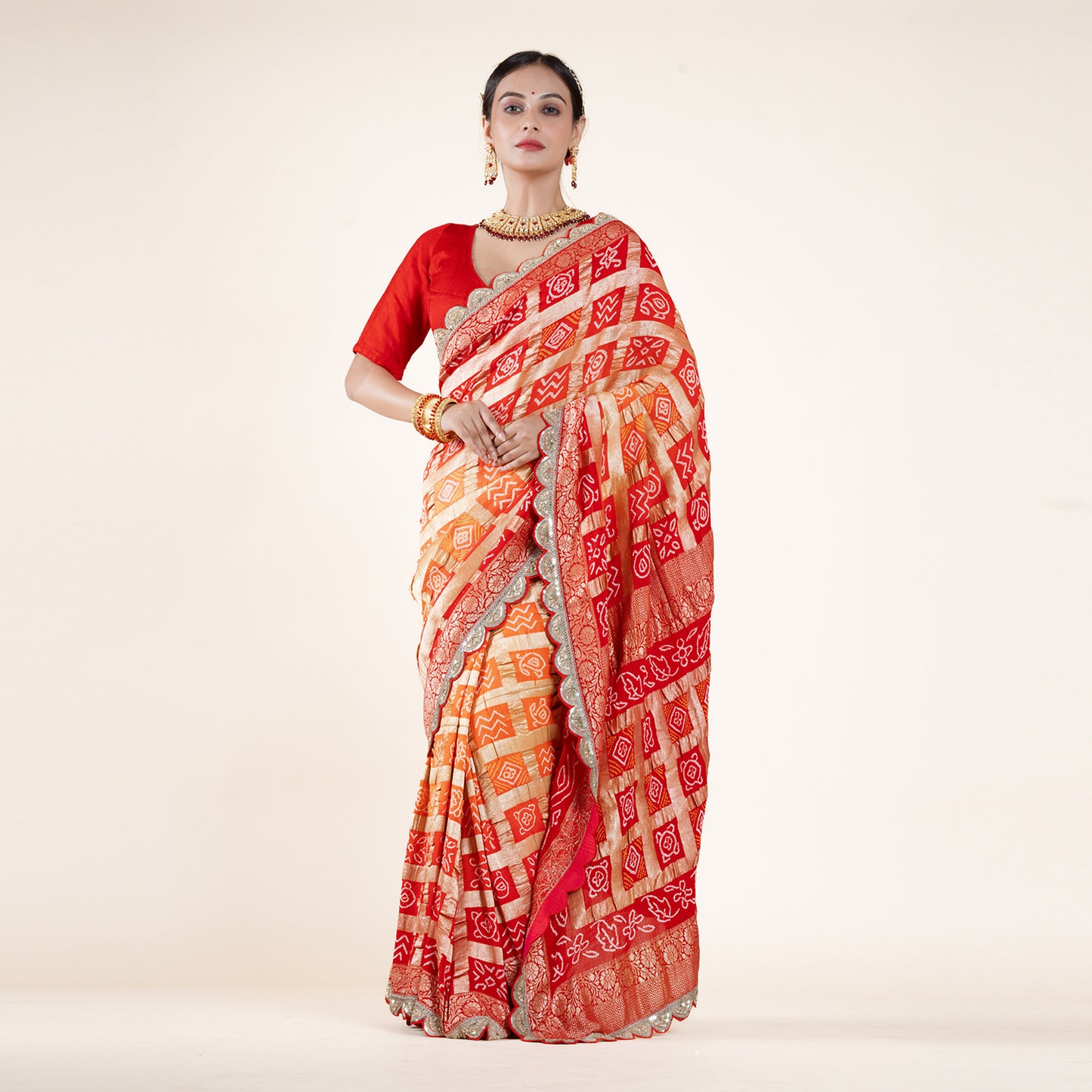 Red-Orange Bandhani Saree with Gold Zari Accents