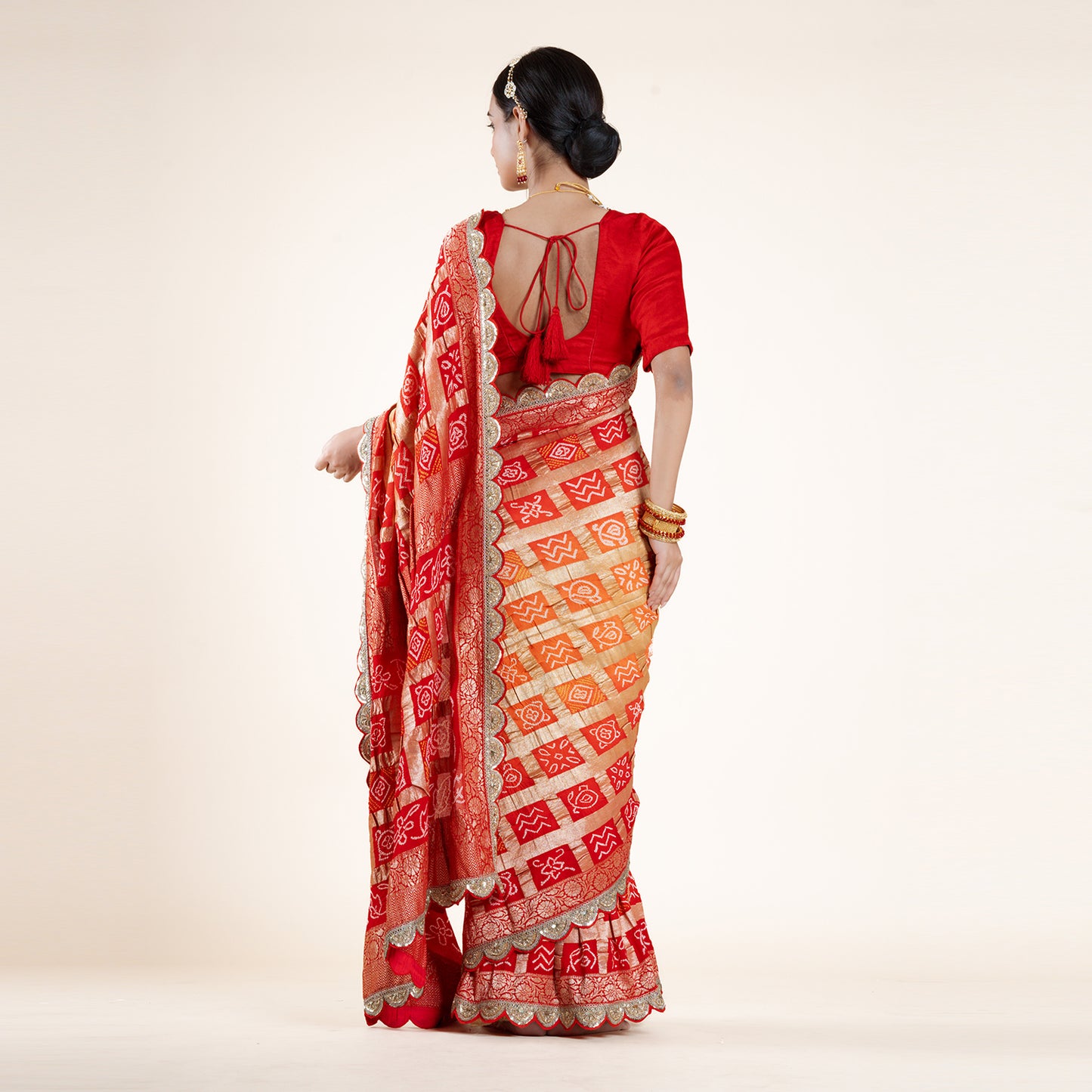 Red-Orange Bandhani Saree with Gold Zari Accents