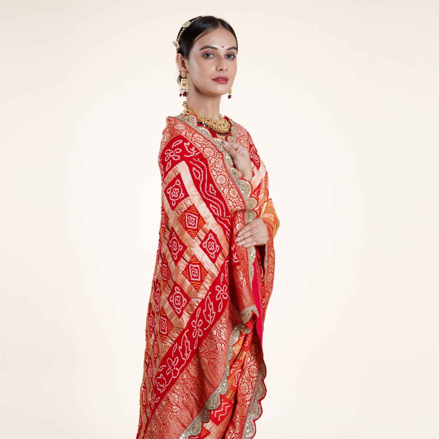 Red-Orange Bandhani Saree with Gold Zari Accents